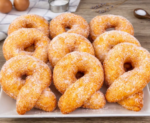 graffe senza patate, ricetta graffe, ciambelle fritte, graffe napoletane, dolci di carnevale, graffe soffici, lievitati dolci, pasta brioche, farina 00, latte, uova, burro, lievito di birra, ricetta facile e veloce, colazione sana, merenda golosa, pasticceria casalinga, ricetta tradizionale italiana, dolci per buffet, dessert fine pasto, ricetta con lievito, dolci per feste, cucina italiana autentica, dolci fatti in casa, ricetta della nonna, graffe farcite, graffe con crema alla nocciola, graffe con marmellata, donuts glassati, colazione italiana, dolci di carnevale